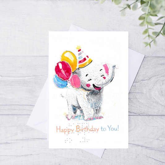 Birthday card with a cartoon elephant holding balloons on a white background