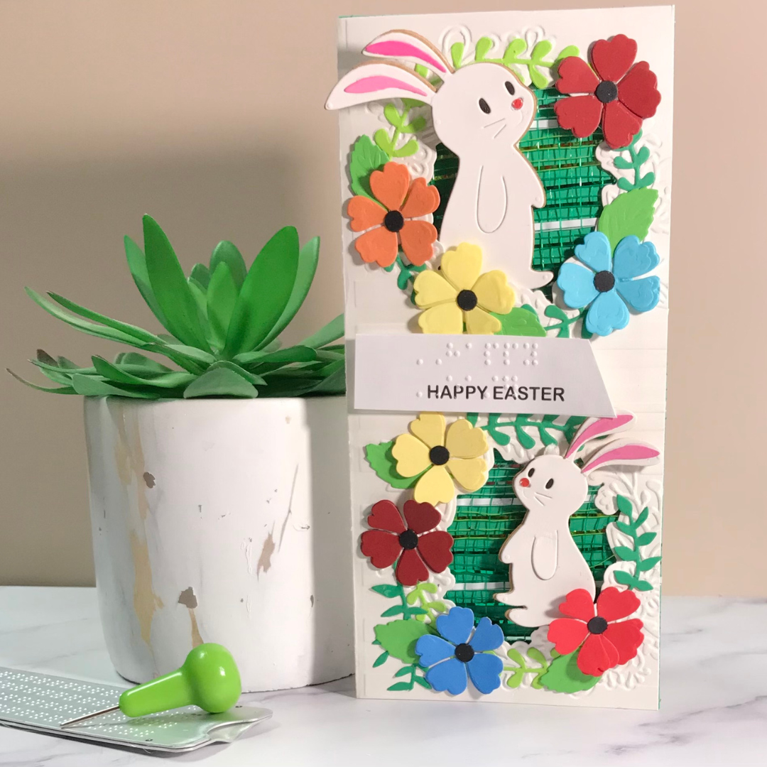 Easter-themed greeting card with bunnies and flowers on a neutral background
