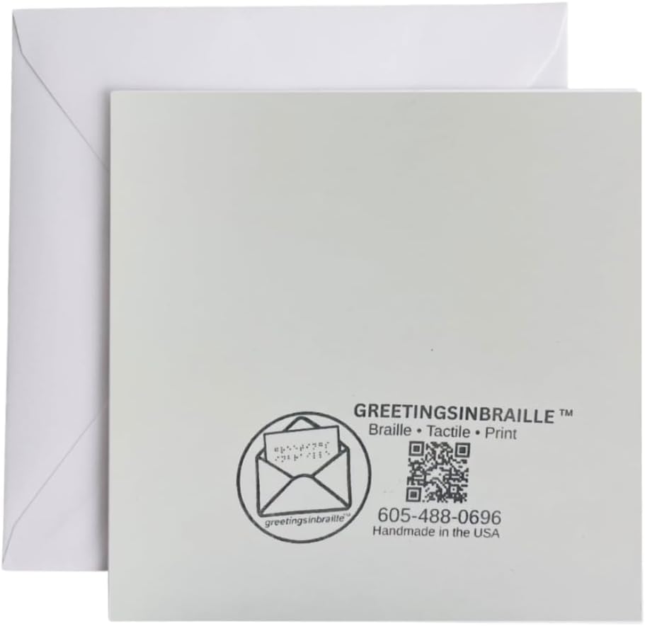 A square white tactile greeting card with black printed text and a circular envelope icon, shown in front of a white envelope on a white background. The card reads 'GREETINGSINBRAILLE' and includes a QR code and 'Handmade in the USA' text.