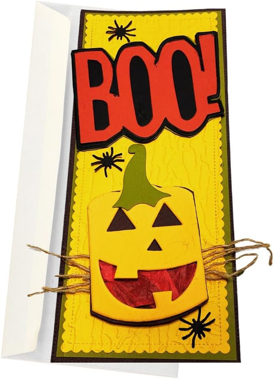 A Halloween greeting card featuring a yellow jack-o'-lantern with a green stem, large red 'BOO!' lettering, black spider silhouettes, and twine details, shown with a white envelope behind it.