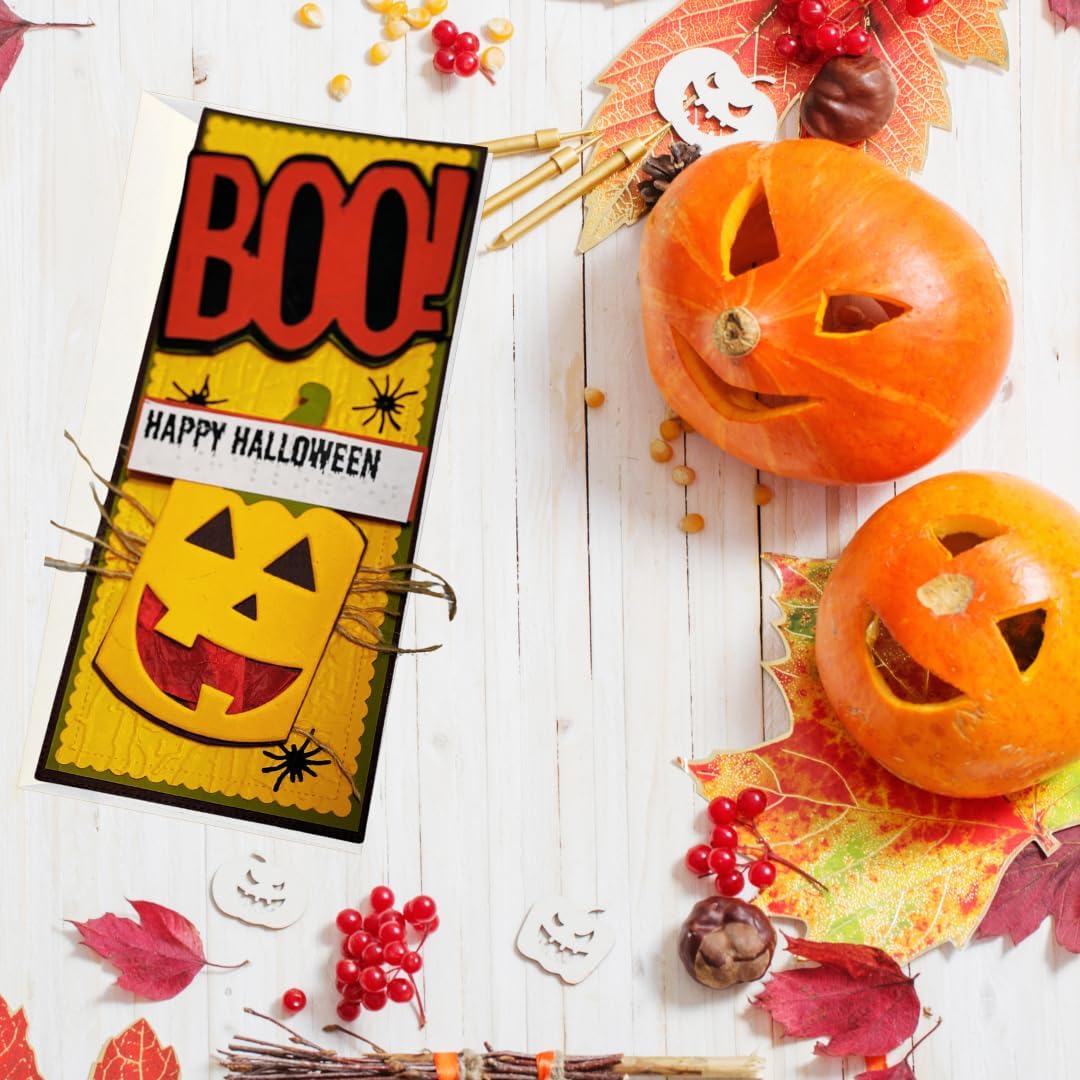 A Halloween-themed greeting card with 'BOO!' and 'HAPPY HALLOWEEN' text, styled on a white wood background with carved pumpkins, autumn leaves, berries, and small decorative props.