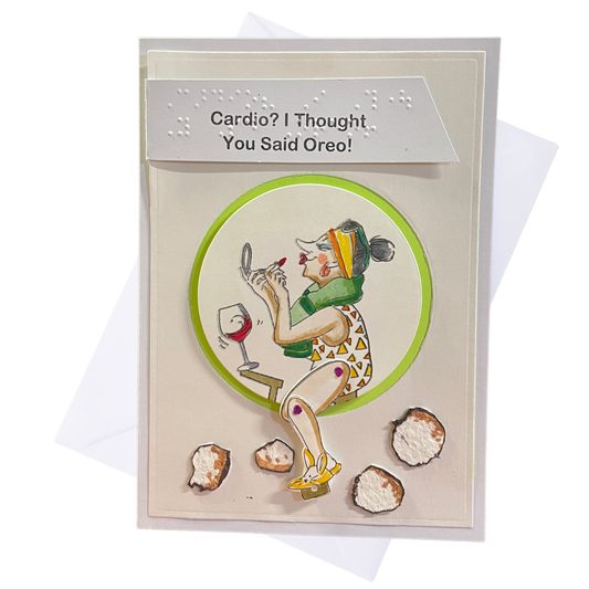 A handmade greeting card with a humorous message, featuring a 3D illustration of a woman on an exercise bike, a towel around her neck, and she is looking in a mirror adding lipstick, and oreo cookies on the floor. The text 'Cardio? I Thought You Said Oreo!' on a white header.
