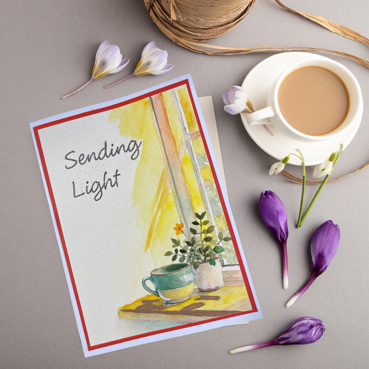 Flat lay with purple crocus flowers, coffee cup, and raffia ribbon