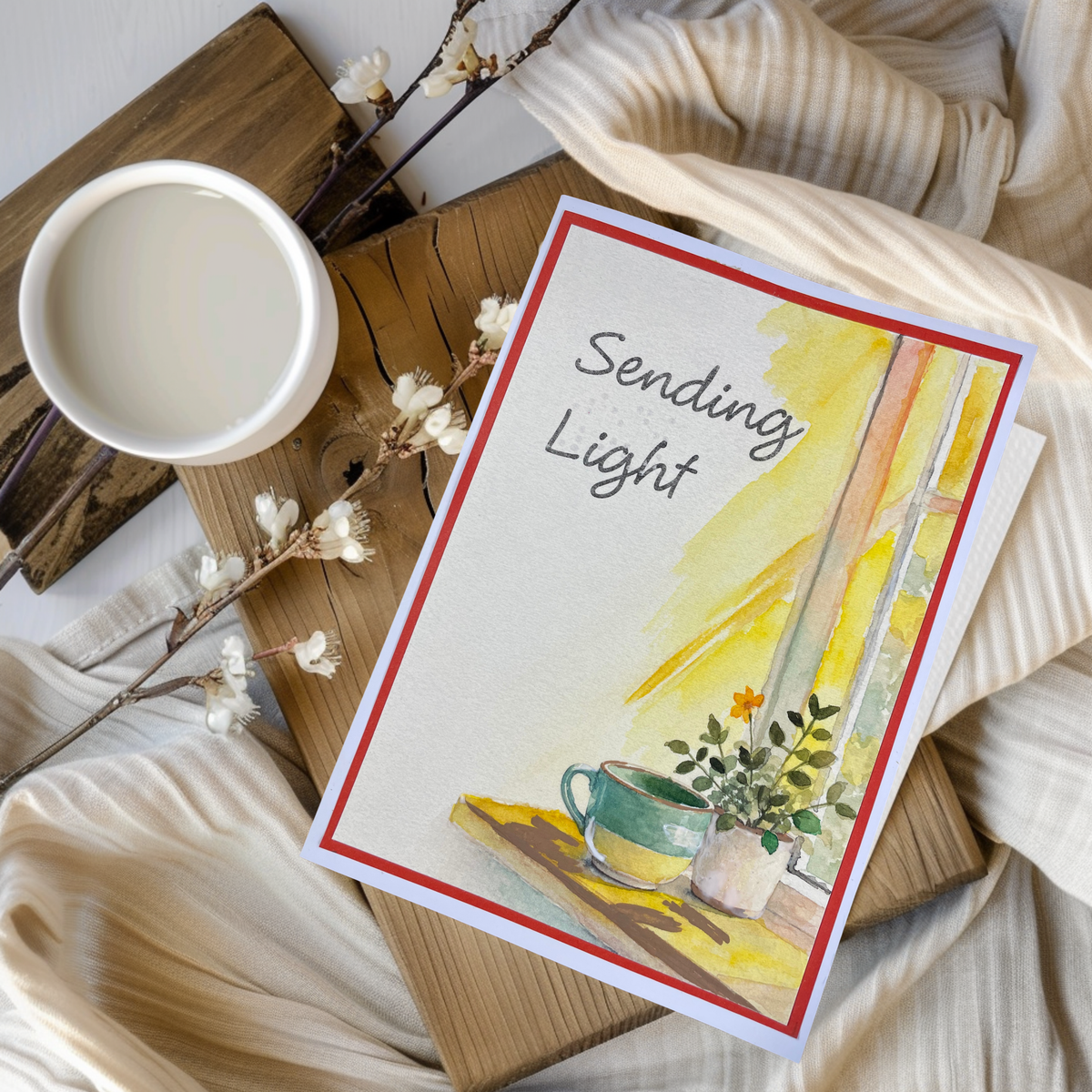 On a rustic wooden tray with a white mug and dried cotton branches