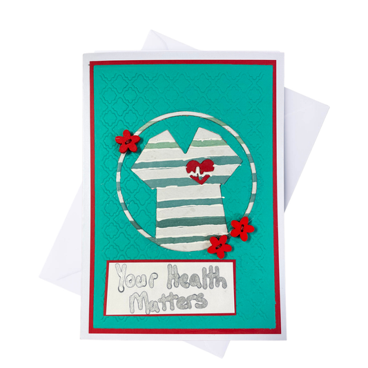 A personalized greeting card featuring a turquoise background with a red border, a striped beach shirt graphic, red flowers, and the text 'Your Health Matters'. A white envelope is visible behind the card on a white background.
