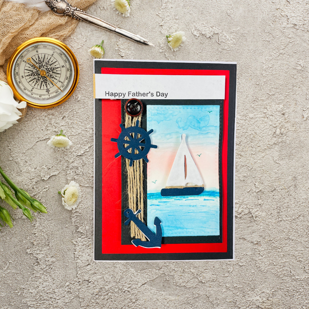 Father's Day card with sailboat illustration, compass, and flowers on a textured surface