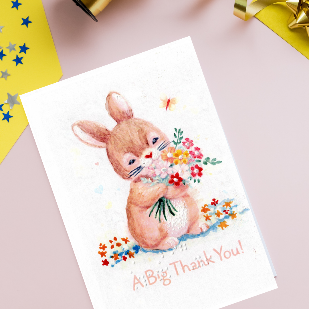 Greeting card with a bunny holding flowers and 'A Big Thank You!' text on a pink background.