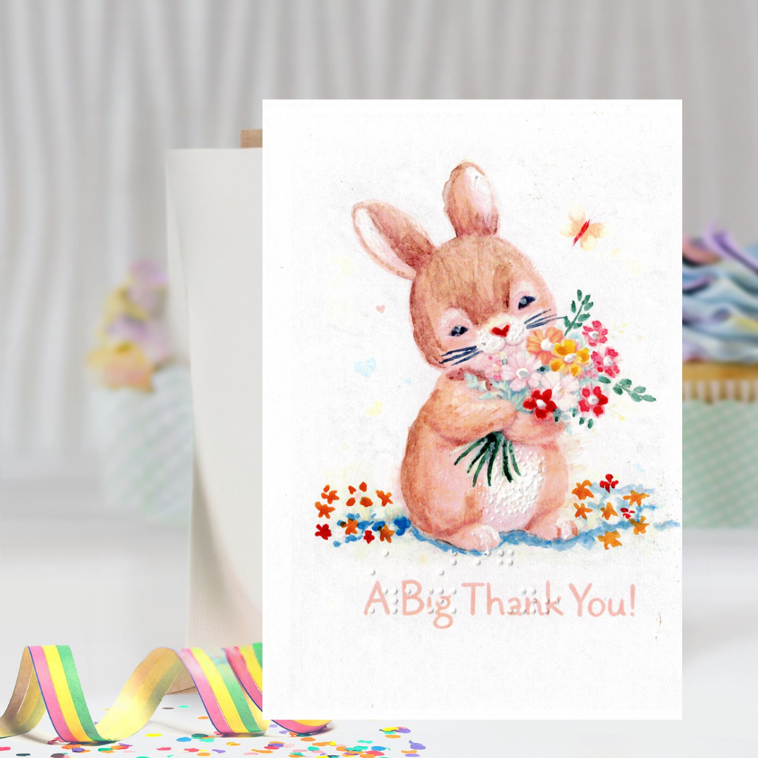 Card with a bunny holding flowers and 'A Big Thank You!' text, with a blurred background.