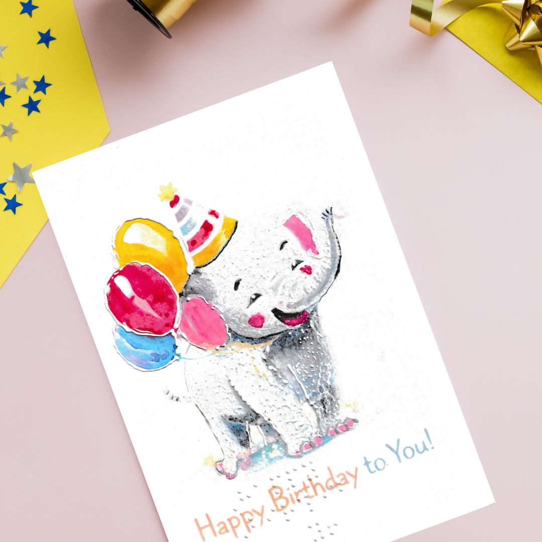 Birthday card with a cartoon elephant wearing a party hat and balloons on a pink background.