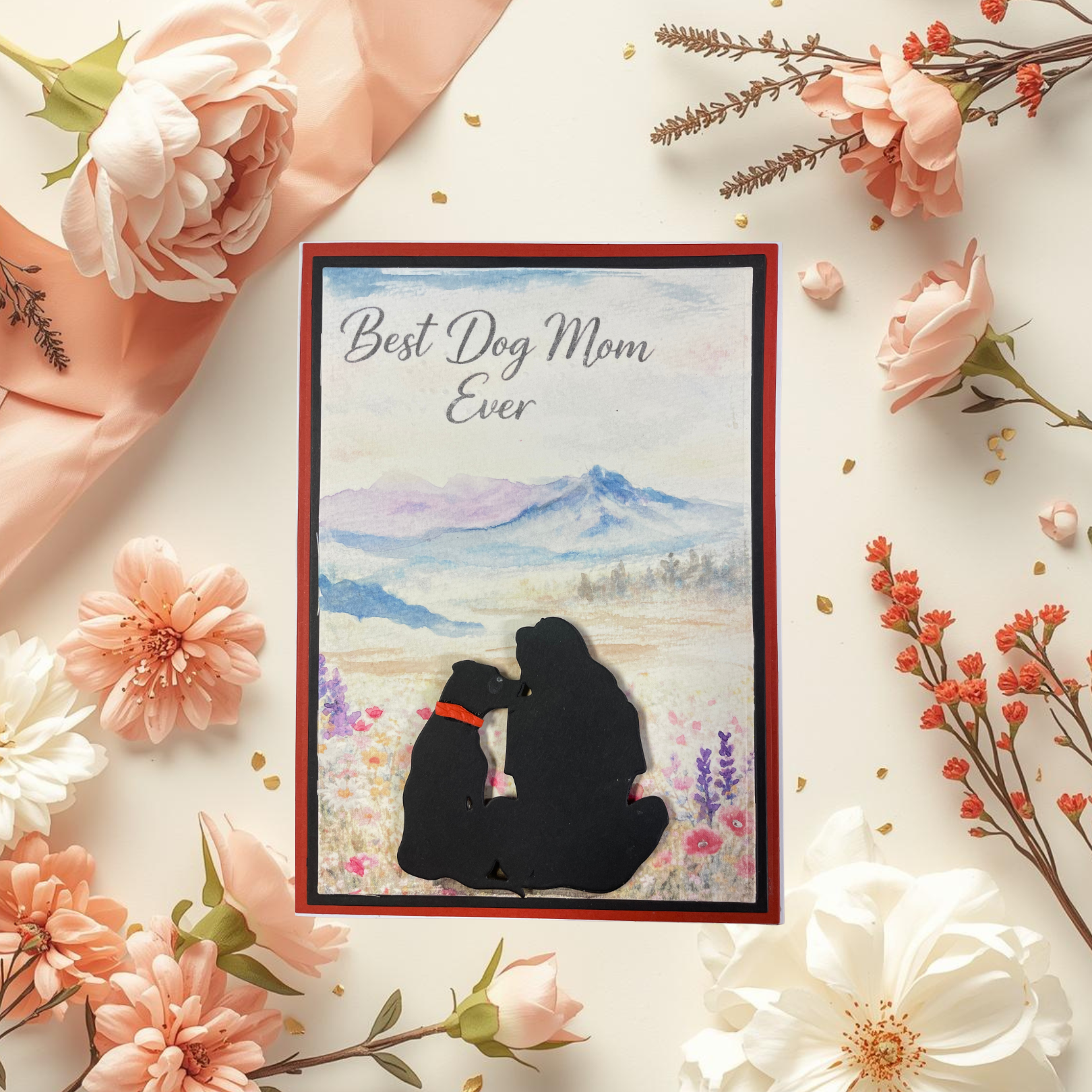 Card with 'Best Dog Mom Ever' text and silhouette of a dog and owner, surrounded by flowers.