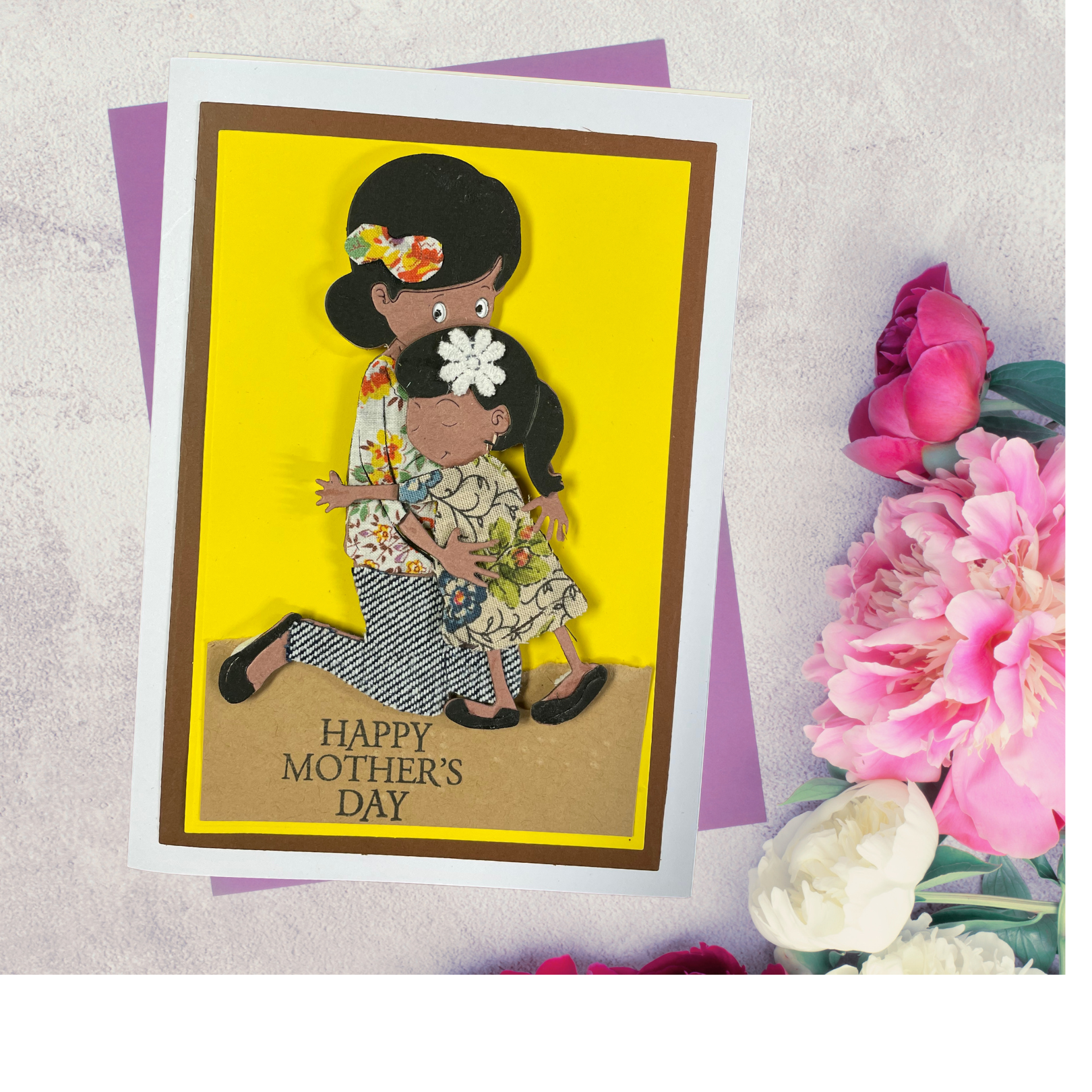 Mother's Day card with a tactile image  of a mother and daughter on a yellow background, surrounded by flowers.
