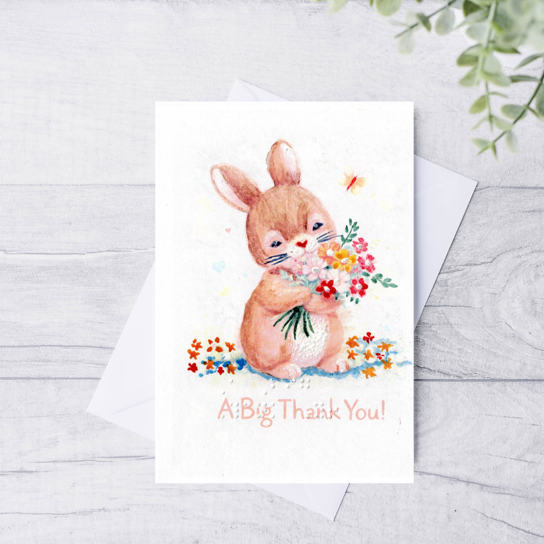 Greeting card with a bunny holding flowers and 'A Big Thank You!' text on a white background.