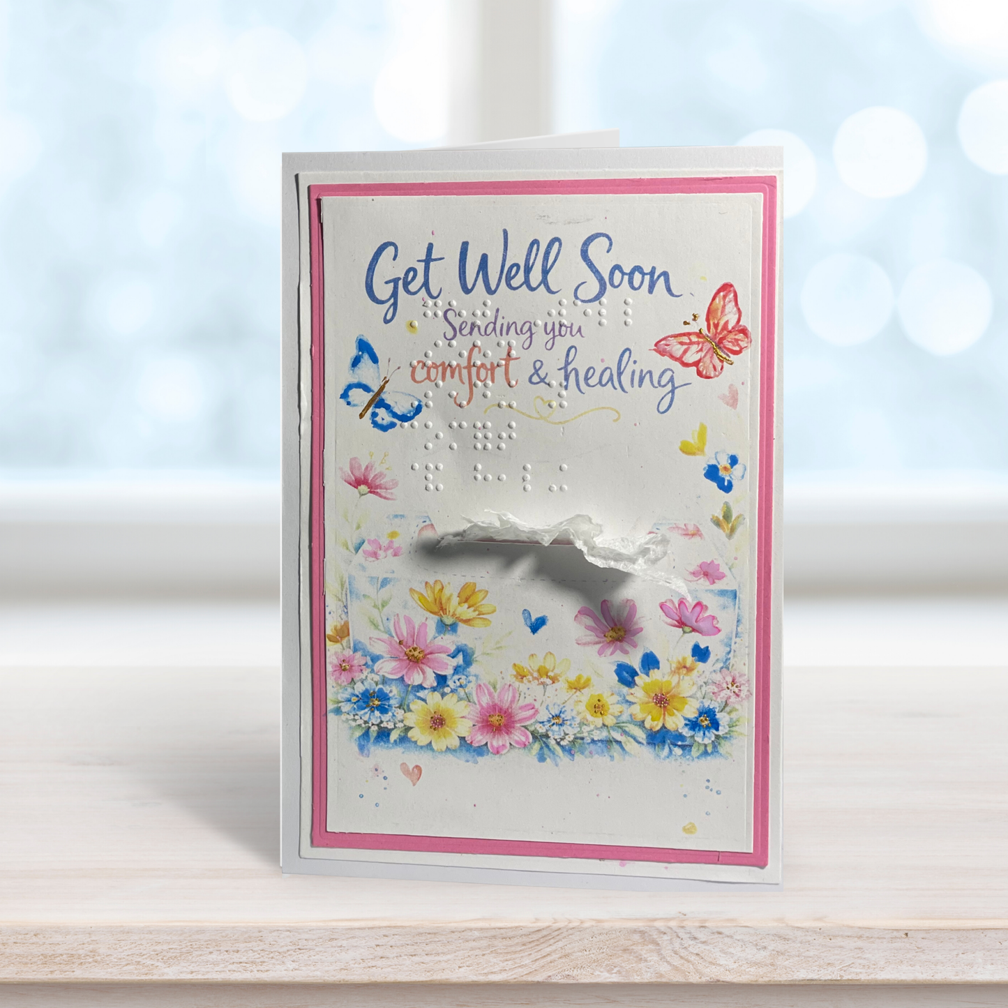 Get Well Soon card with flowers and butterflies on a blurred background