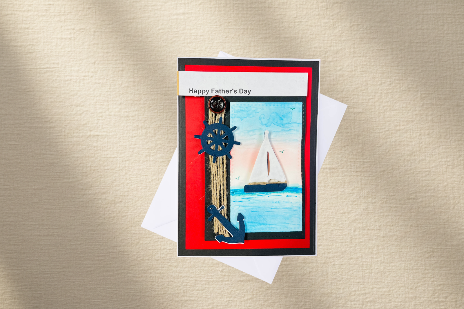 Father's Day card with nautical design featuring a ship and anchor on a gold background