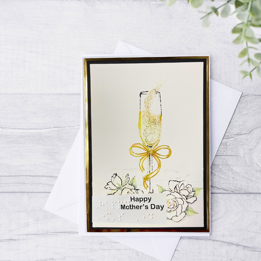 Greeting card with a champagne glass and flowers on a white background