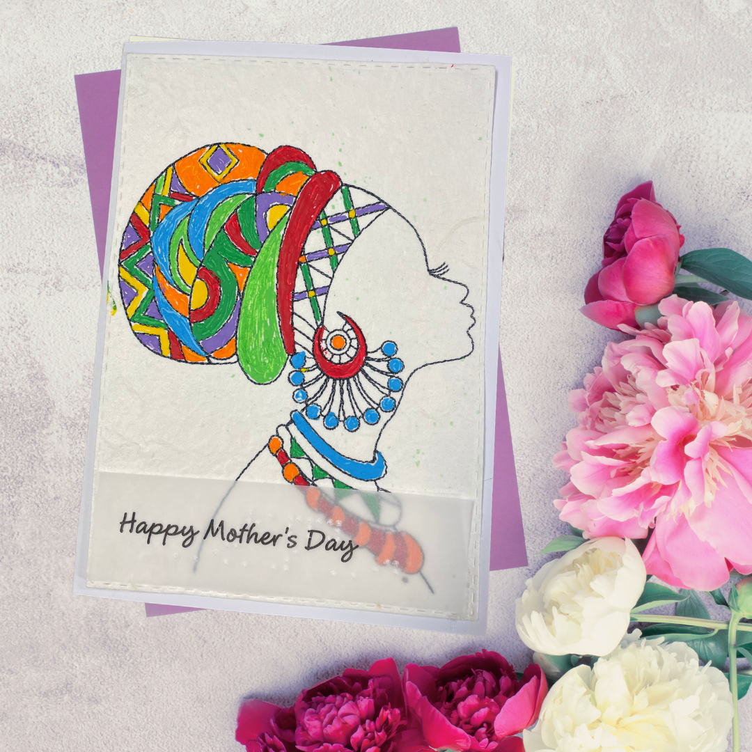 Mother's Day card features a hand-drawn profile silhouette of a woman adorned with a vivid geometric head wrap in orange, red, green, blue, and purple, paired with layered statement jewelry in matching jewel tone flowers on a textured surface.