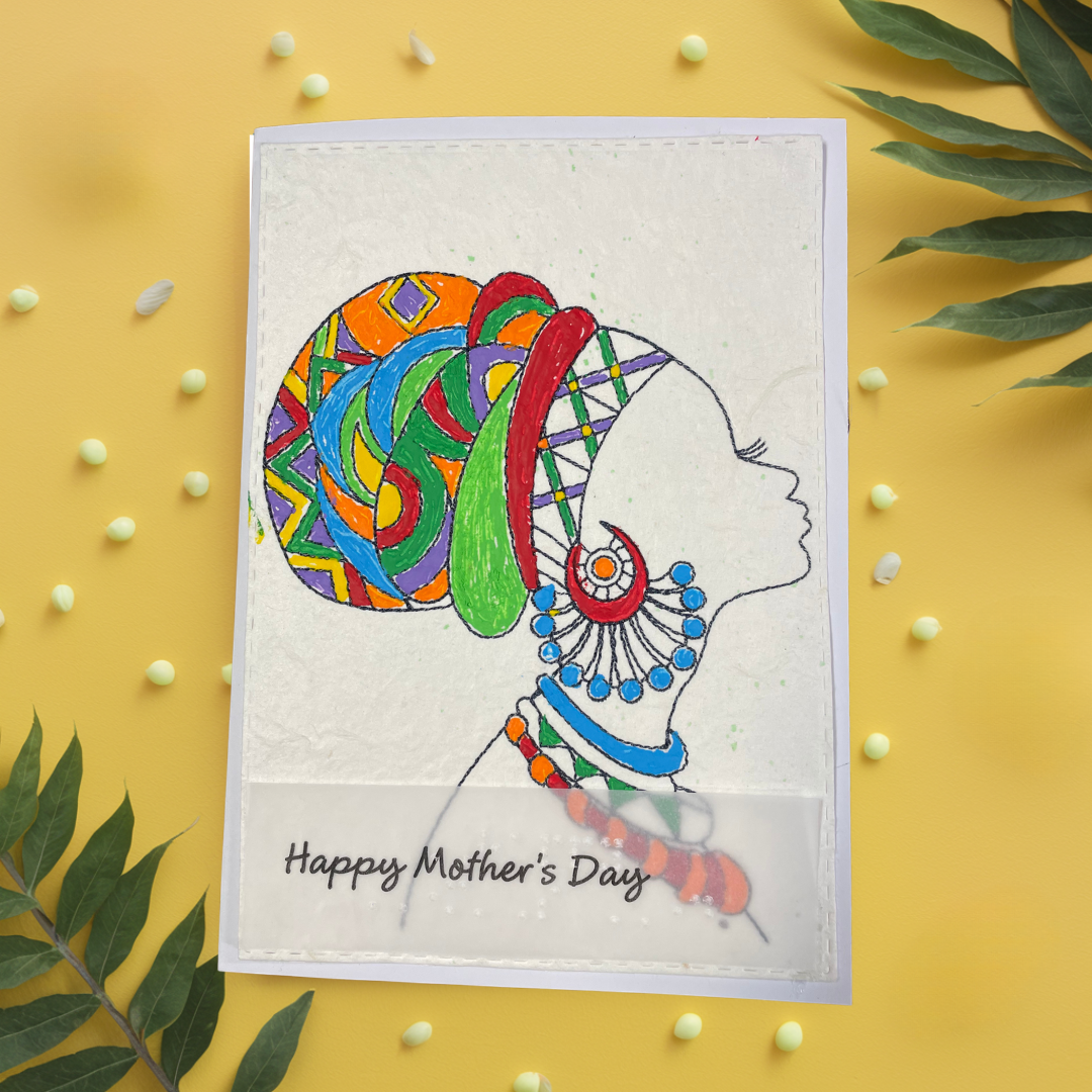 Mother's Day card features a hand-drawn profile silhouette of a woman adorned with a vivid geometric head wrap in orange, red, green, blue, and purple, paired with layered statement jewelry in matching jewel tone 'Happy Mother's Day' text on a yellow background.