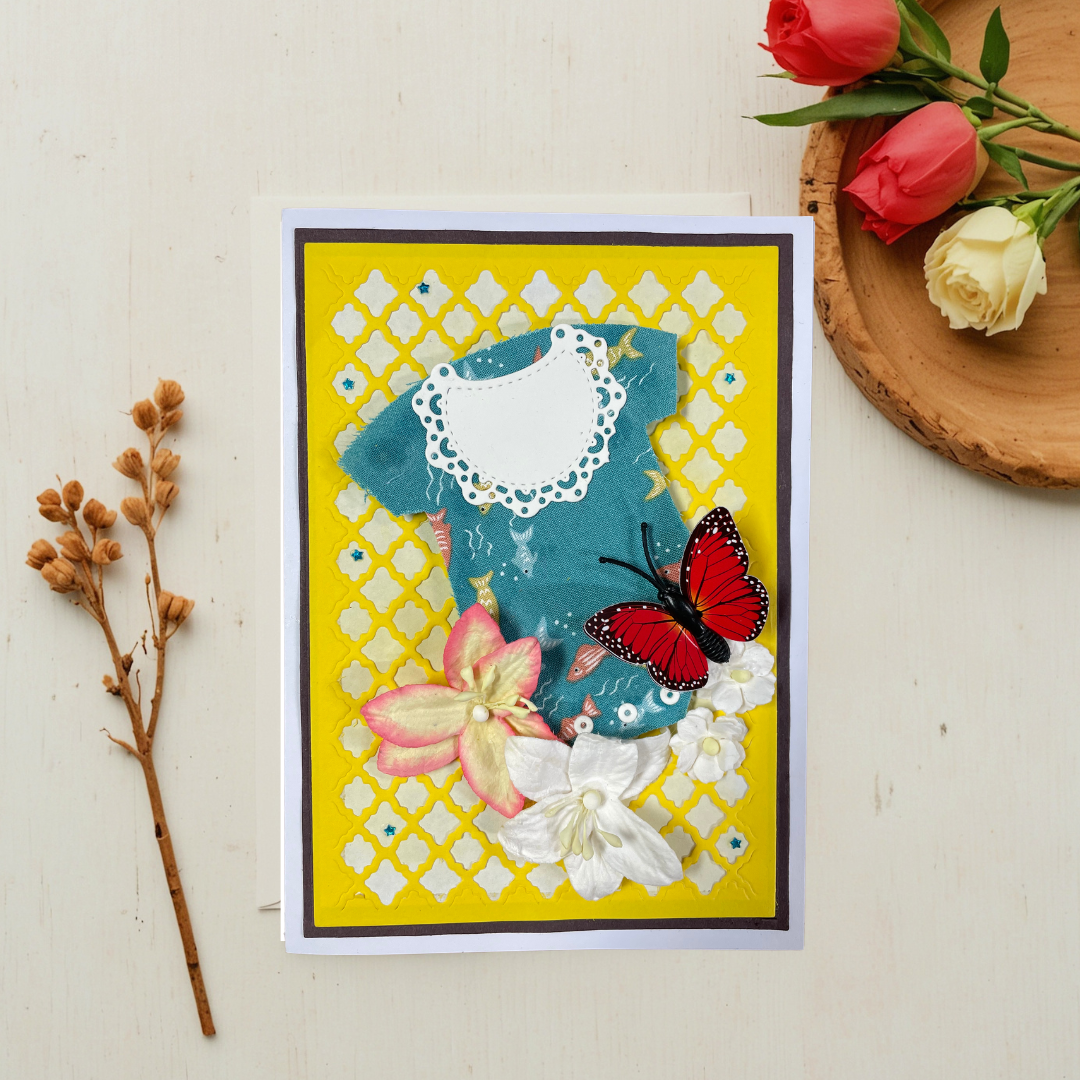 Decorative card with flowers and a butterfly on a light surface with floral elements.