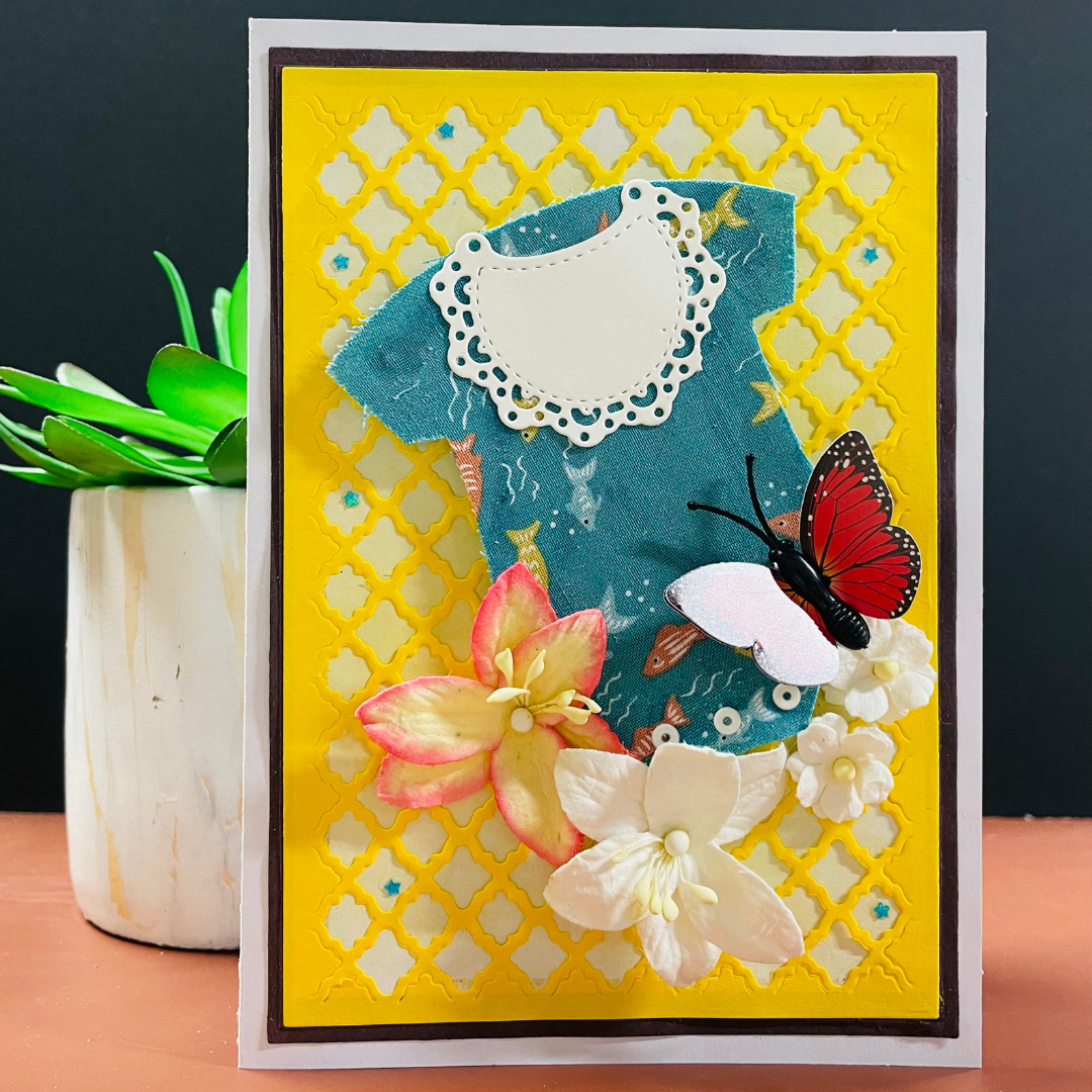 Decorative card with flowers and a butterfly on a yellow lattice Handmade boxed Mother’s Day greeting cards for a new mom, featuring a baby outfit design, layered flowers, butterfly embellishments