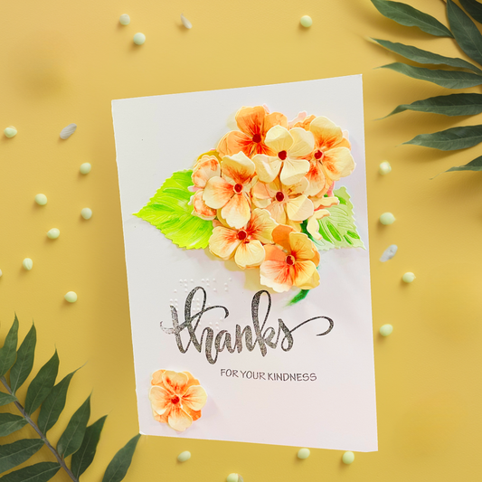 A handmade thank you card with 3D Peach Hydrangea Bouquet flowers and green leaves, featuring the stamped text 'thanks FOR YOUR KINDNESS' in black, styled on a yellow background with decorative green leaves and small beads.