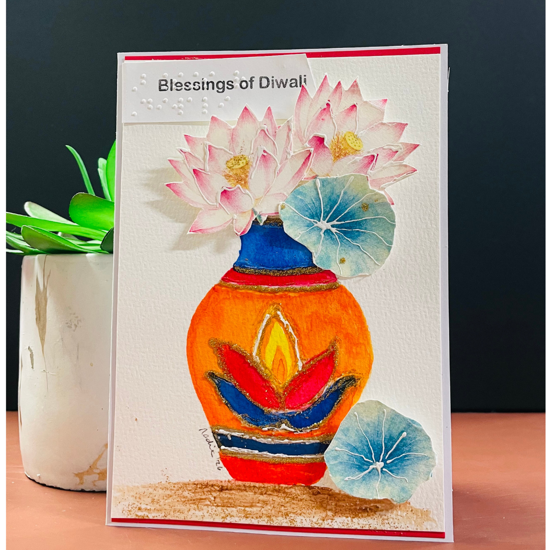 Hand-painted Blessings of Diwali greeting card with lotus flowers and diya.