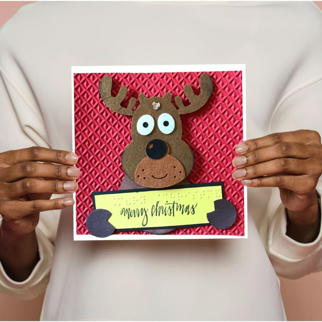 Braille Christmas Greeting Card – "Playful Reindeer with sign"