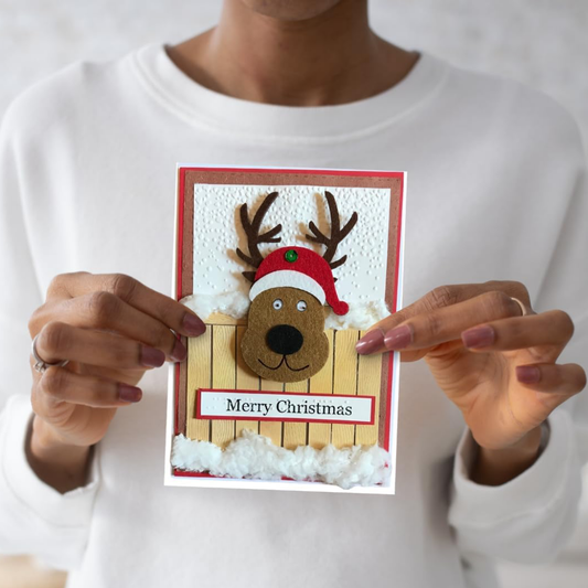 Braille Christmas Greeting Card – Festive Reindeer at Fence