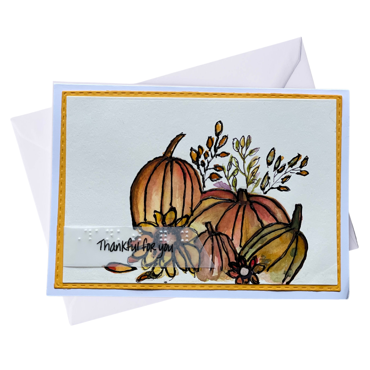 Handmade Thanksgiving greeting card with watercolor pumpkins and fall leaves.