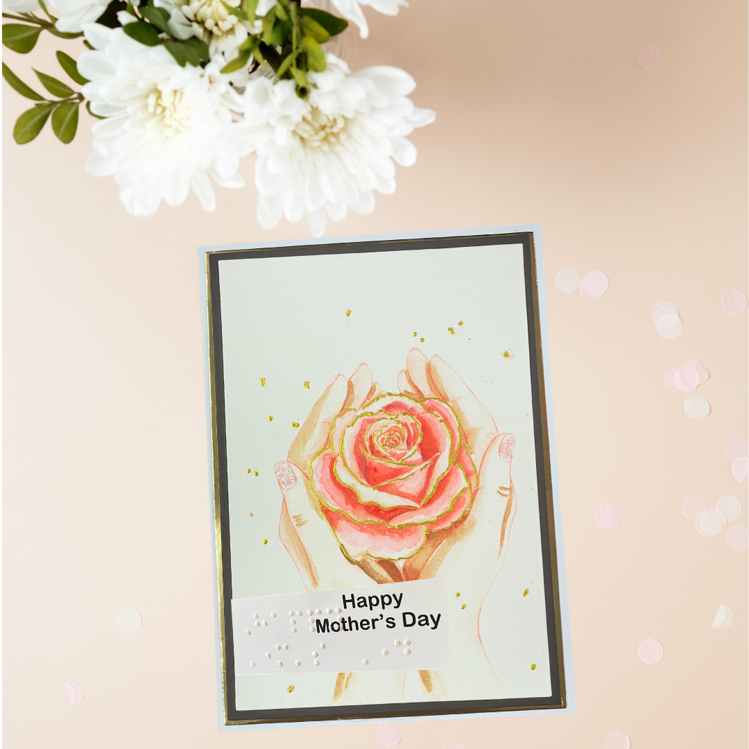 Greeting card with hands holding a rose and 'Happy Mother's Day' text, surrounded by white flowers on a beige background.